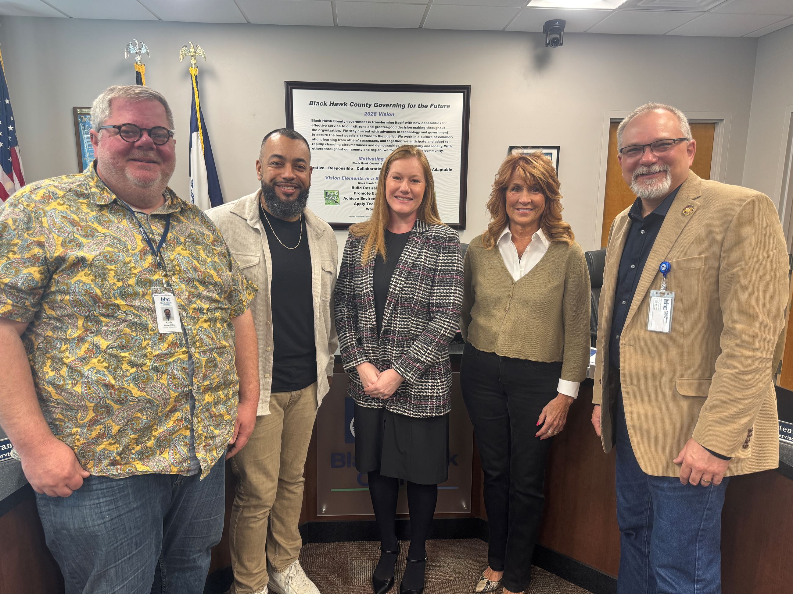 The Board of Supervisors pose with Kaitlin Emrich, Public Health Director